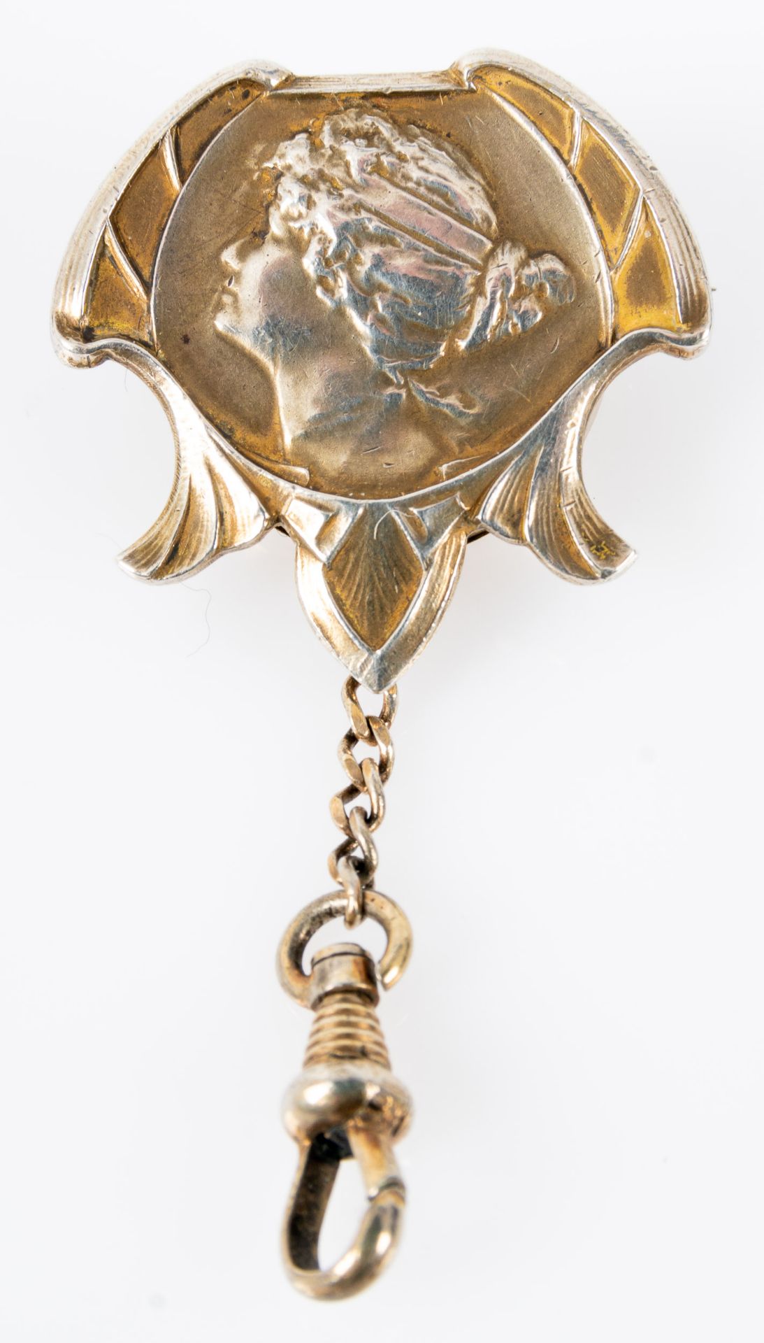 Damenuhrkette, Jugendstil, versenkt in einer Brosche mit Mädchenkopf im Halbrelief, 800er Silber. F