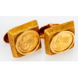 Paar "Goldmünzen"-Manschettenknöpfe, 585er Gelbgold, ca. 20 gr. brutto, schöner, getragener Erhalt.