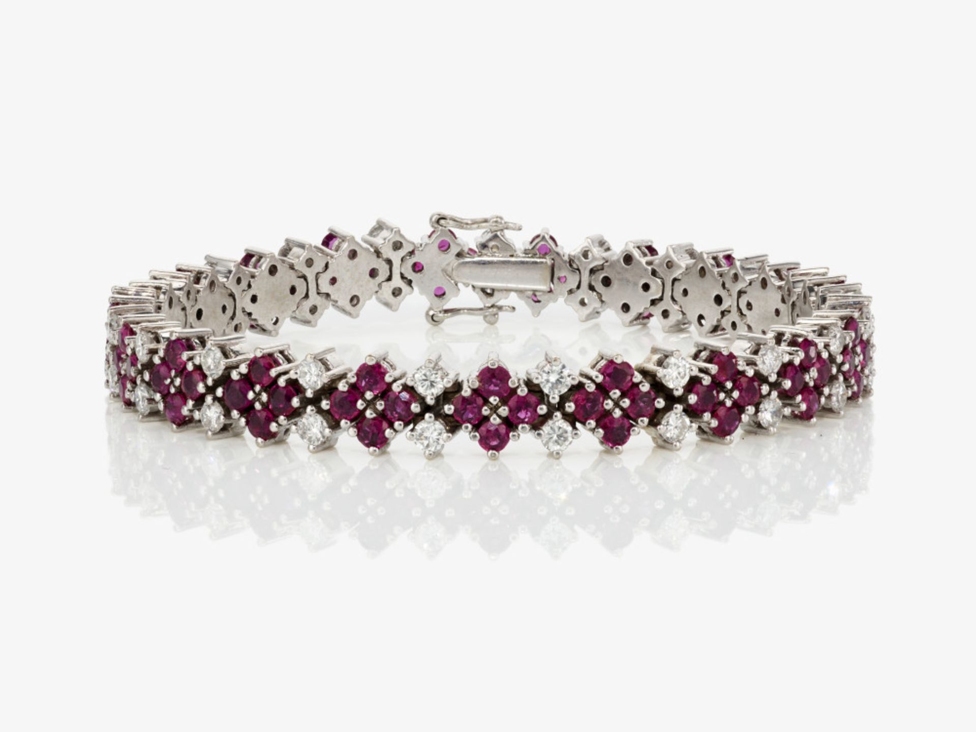 A cocktail bracelet decorated with brilliant cut diamonds and rubies - Germany, 1970s 