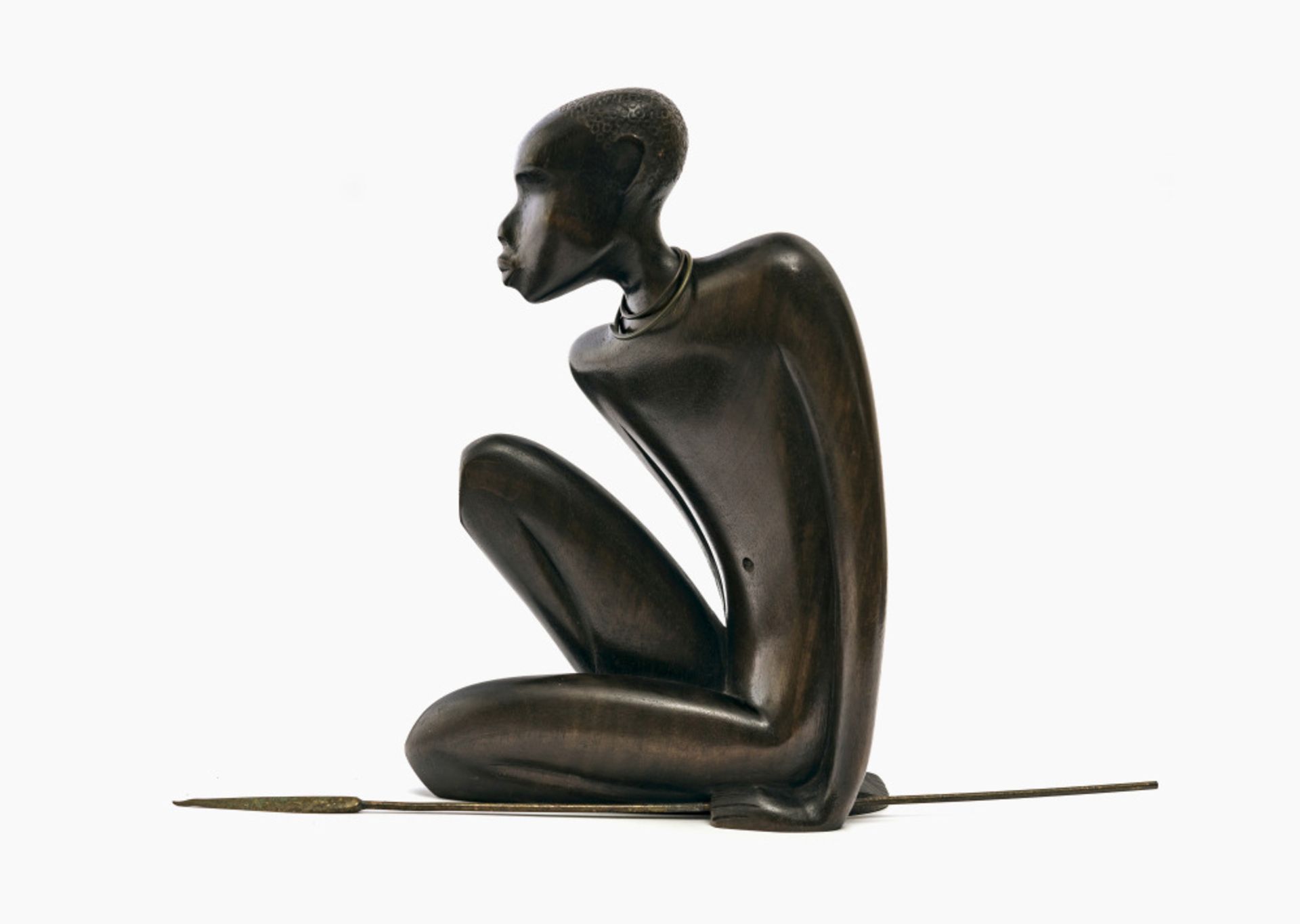 A seated African with spear - Werkstätten Hagenauer, Vienna, 1950s 