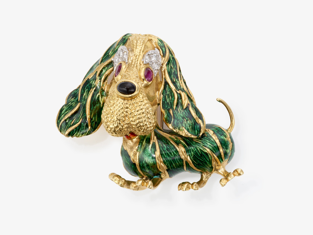 A brooch in the shape of a basset with green enamel, rubies, onyx and brilliant-cut diamonds 
