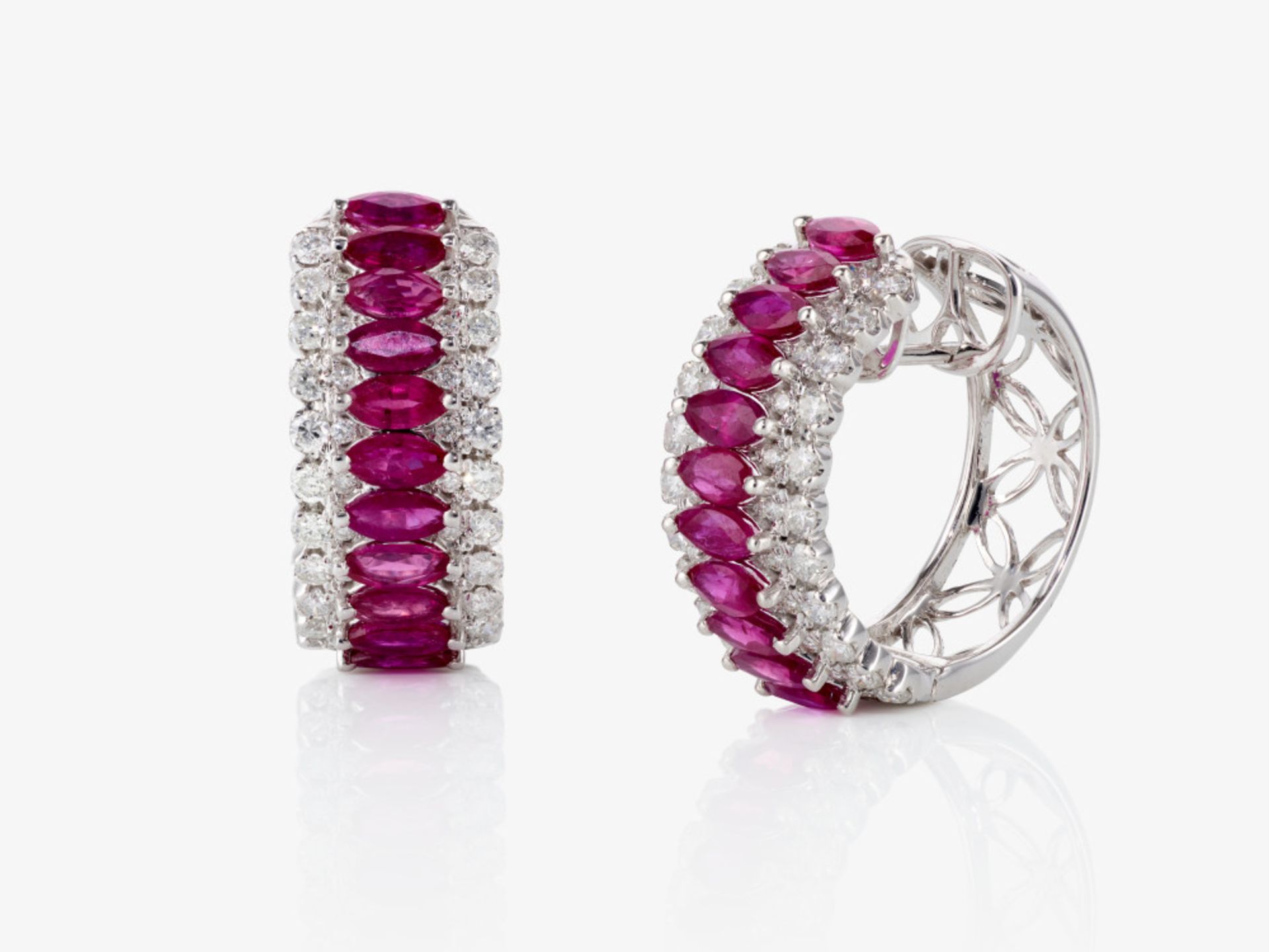 A pair of hoop earrings decorated with rubies and brilliant-cut diamonds - Italy 