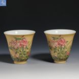 A pair of yellow glaze pastel wine glasses from Qing Dynasty