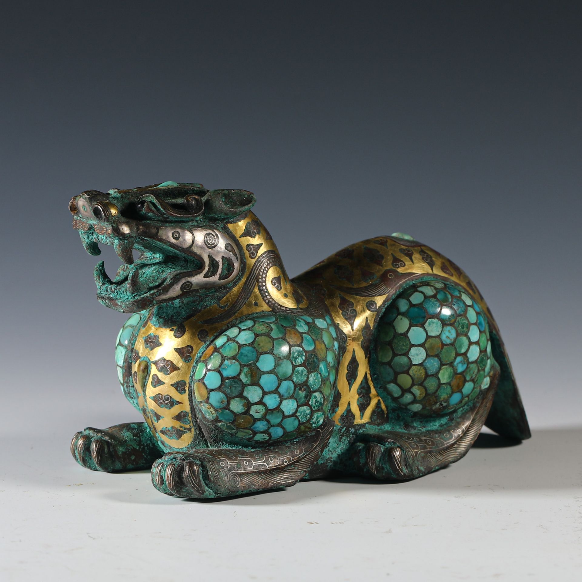 Gold and silver inlaid pine stone auspicious beast from the Han  dynasty