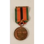 An unnamed gilt metal Irish War of Independence Black and Tan Truce medal 1921-1971; complete with