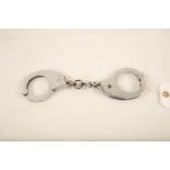 A set of Hiatts stainless steel juvenile handcuffs; 26cm long Reserve: £20 #1246