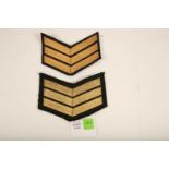 A set of post 1970s Royal Ulster Constabulary Sargent stripes; embroidered with shamrock details;