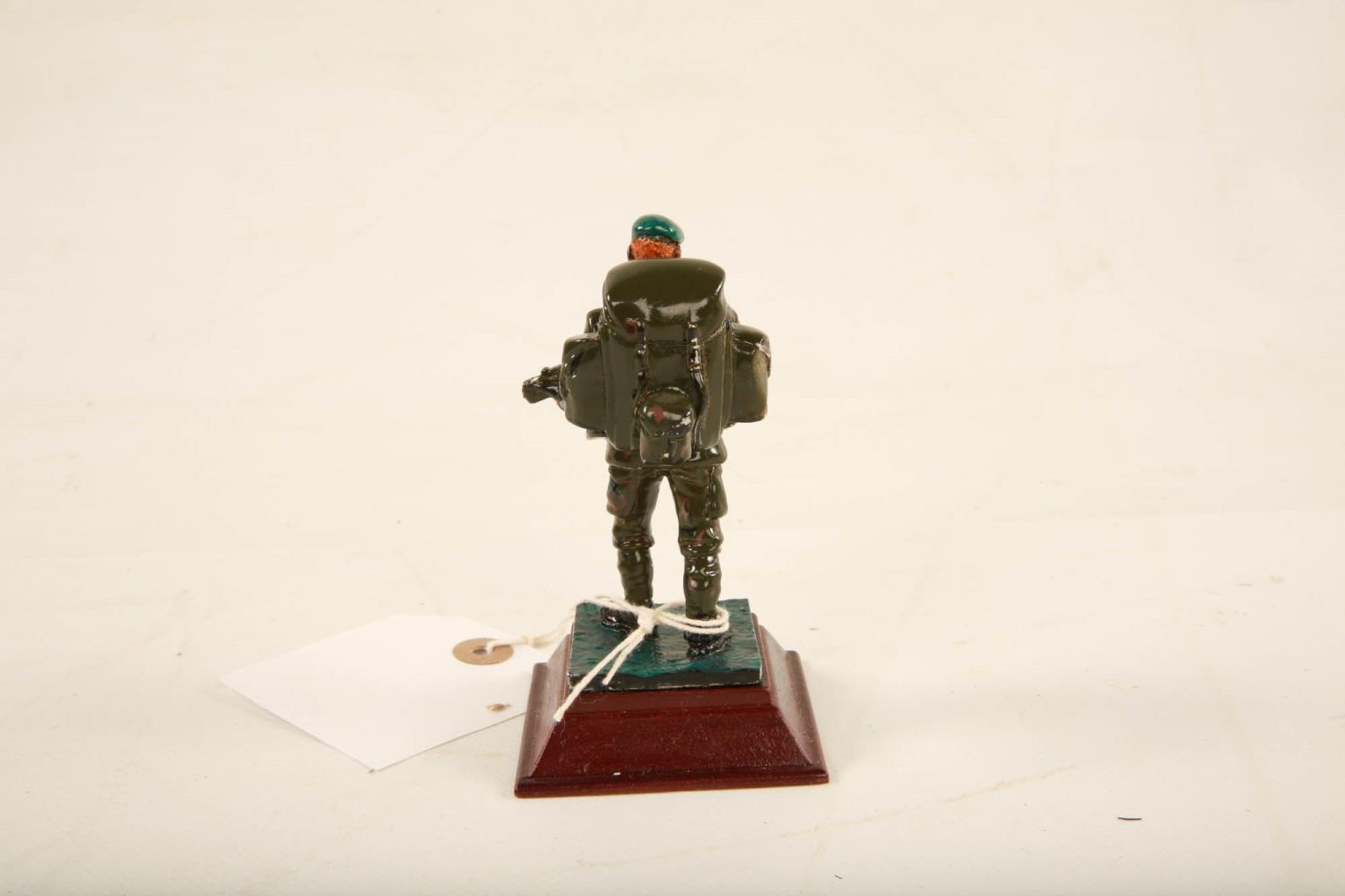 A painted lead model of an Ulster Defence Regiment soldier raised on square wooden plinth; 11cm high - Image 6 of 6