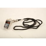 An Acme 'Thunderer' stainless steel Policeman's whistle on black cord (whistle length 45mm) Reserve: