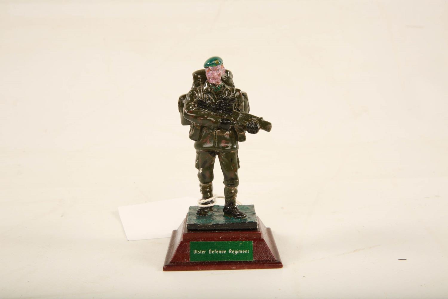 A painted lead model of an Ulster Defence Regiment soldier raised on square wooden plinth; 11cm high - Image 2 of 6