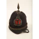 An original Royal Irish Constabulary King's Crown badge mounted on red felt; 10cm long applied to