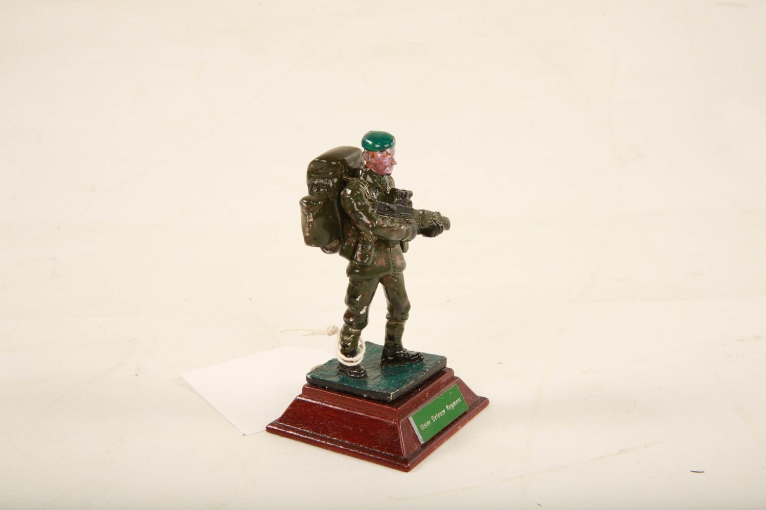 A painted lead model of an Ulster Defence Regiment soldier raised on square wooden plinth; 11cm high - Image 4 of 6
