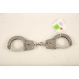 A pair of Chubb stainless steel handcuffs; 28cm long Reserve: £30 #1249