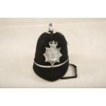 A Police Constable hat with applied North Wales Police plate (29.5cm long) Reserve: £25 #1211