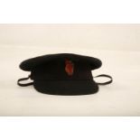 An original 1910 Royal Irish Constabulary King's Crown Badge mounted on red felt; 42mm long