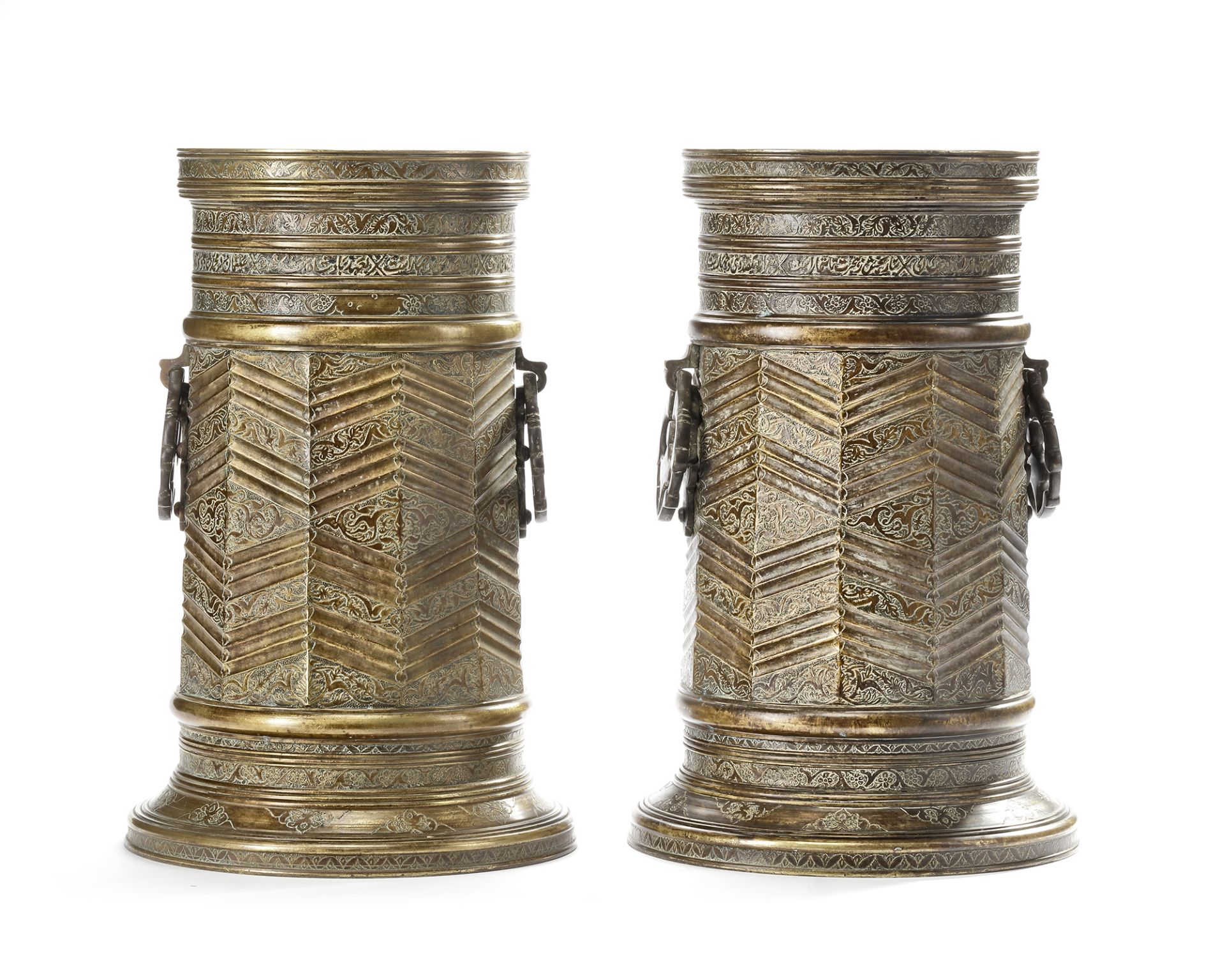 A PAIR LARGE OF SAFAVID STYLE ENGRAVED BRASS TORCH STANDS, PERSIA, 18TH -19TH CENTURY