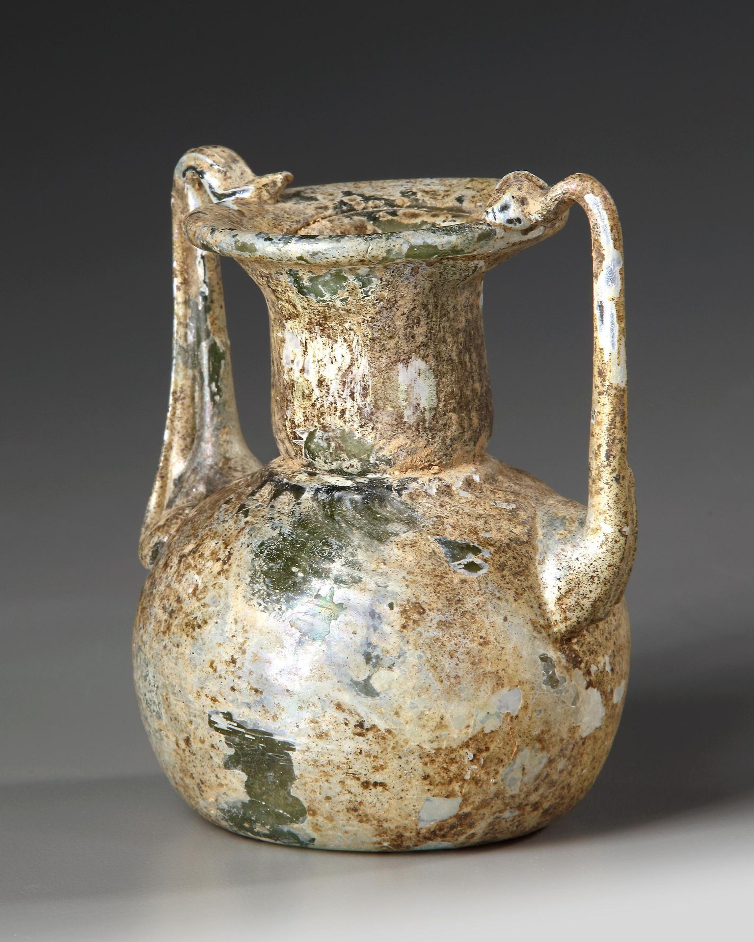 A ROMAN GLASS JAR WITH TWO HANDLES, CIRCA 3RD-4TH CENTURY A.D. - Image 4 of 4