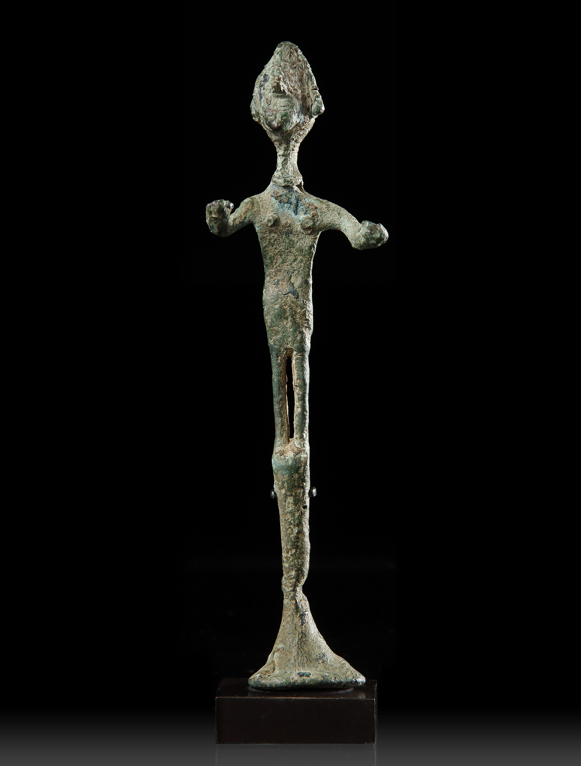 A CANAANITE BRONZE STANDING FIGURE, CIRCA 2ND CENTURY B.C.