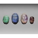A GROUP OF FOUR HARD STONE SCARABS, CIRCA 1500-500 B.C.