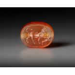 AN EASTERN GREEK CARNELIAN SCARABOID SEAL WITH LION, CIRCA 5TH CENTURY B.C.