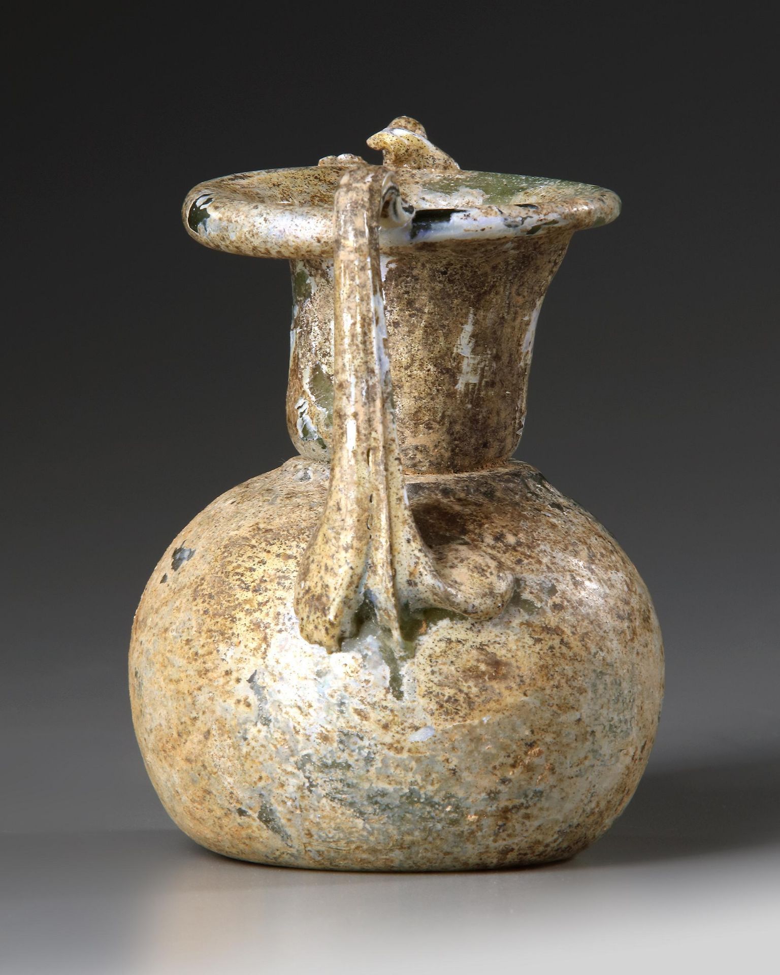 A ROMAN GLASS JAR WITH TWO HANDLES, CIRCA 3RD-4TH CENTURY A.D. - Image 2 of 4
