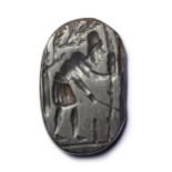 A ROMAN HEMATITE MAGICAL GNOSTIC INTAGLIO, CIRCA 3RD-4TH CENTURY A.D.