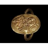A BYZANTINE GOLD RING WITH A LION FACING LEFT, CIRCA 6TH CENTURY A.D.