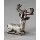 AN ELAMITE SILVER RECLINING STAG, CIRCA 2ND CENTURY B.C.