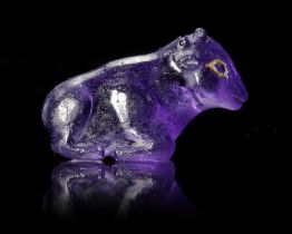 A WESTERN ASIATIC HARDSTONE AMULET OF A SEATED COW OR OX, CIRCA 2ND-1ST CENTURY B.C.