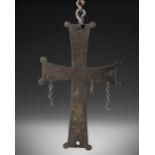 A BYZANTINE BRONZE CROSS WITH GREEK DEDICATION, CIRCA 8TH-10TH CENTURY A.D.