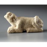 A WESTERN ASIATIC ELAMITE AMULET LIMESTONE WITH LION SEATED, CIRCA 2ND-1ST MILLENNIUM B.C.