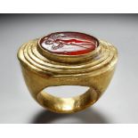 A GREEK GOLD AND CARNELIAN FINGER RING WITH CUPID, HELLENISTIC PERIOD, CIRCA 2ND-1ST CENTURY B.C.