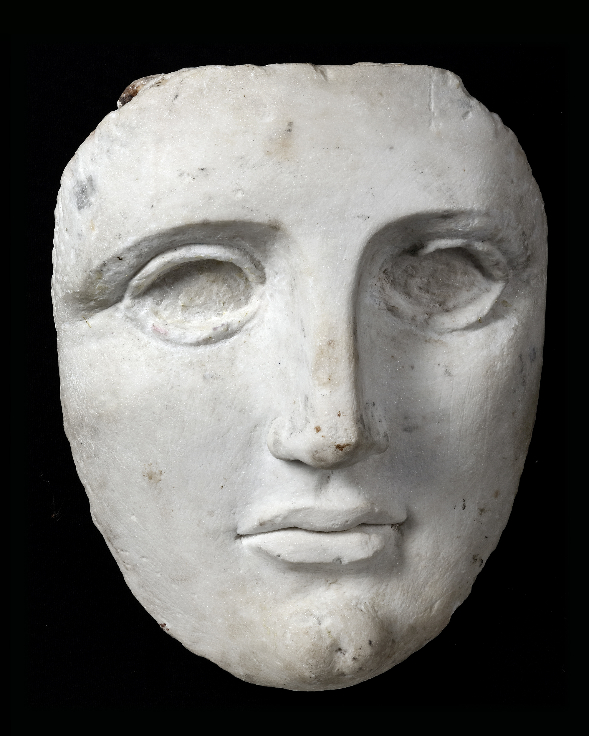 A HELLENISTIC MARBLE FEMALE MASK, EGYPT, 3RD-1ST CENTURY B.C.