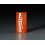 A GRECO PERSIAN AGATE CYLINDER SEAL WITH A MAN AND WINGED BULL, CIRCA 520-440 B.C.