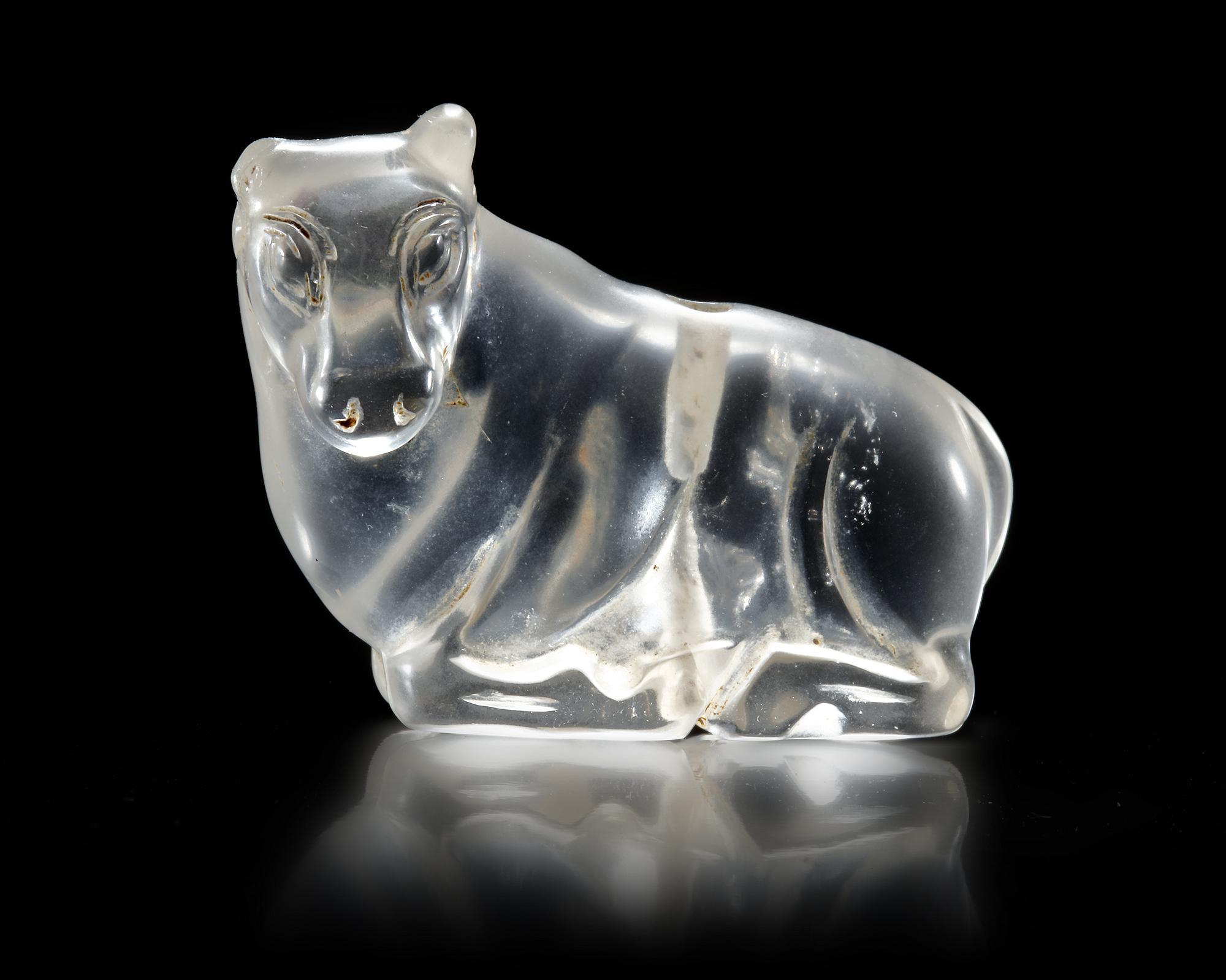 A WESTERN ASIATIC ROCK CRYSTAL RECLINING BULL, CIRCA 2ND CENTURY B.C.