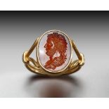 A RENAISSANCE CARNELIAN INTAGLIO PORTRAIT OF THE EMPEROR HADRIAN IN A MODERN GOLD RING, CIRCA 17TH C