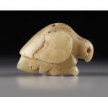 A WESTERN ASIATIC MARBLE SEAL AMULET IN THE FORM OF A BIRD OF PREY, LATE URUK PERIOD, CIRCA 3300-290