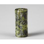 A WESTERN ASIATIC GREEN SERPENTINE CYLINDER SEAL, CIRCA 1900-1700 B.C.