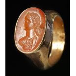 A ROMAN GOLD FINGER RING WITH A CARNELIAN INTAGLIO, CIRCA 1ST-2ND CENTURY A.D.