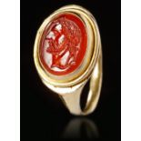 A ROMAN CARNELIAN INTAGLIO WITH GOLD RING, CIRCA 2ND-3RD CENTURY A.D.