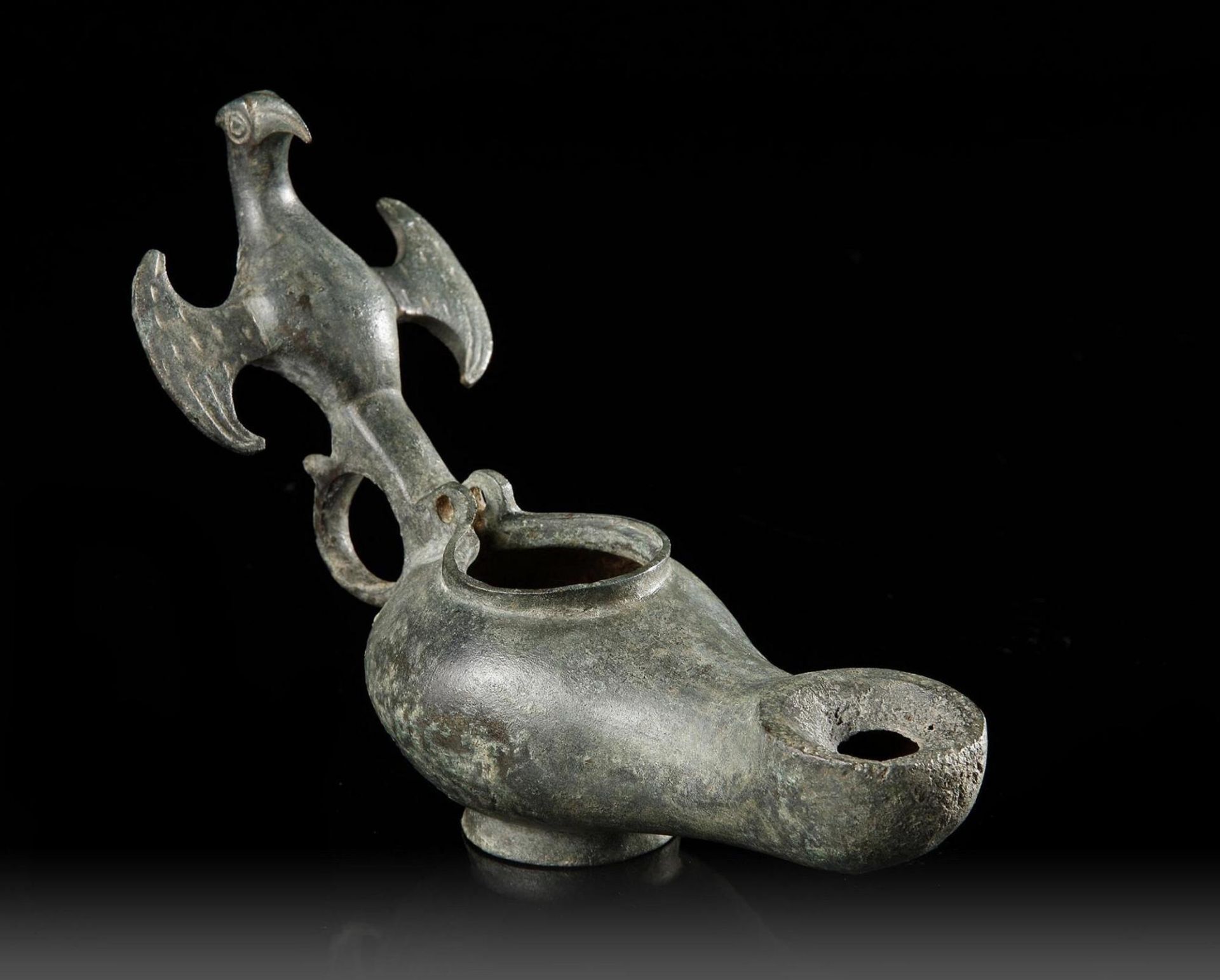 A BYZANTINE BRONZE OIL LAMP, CIRCA 5TH-6TH CENTURY A.D.