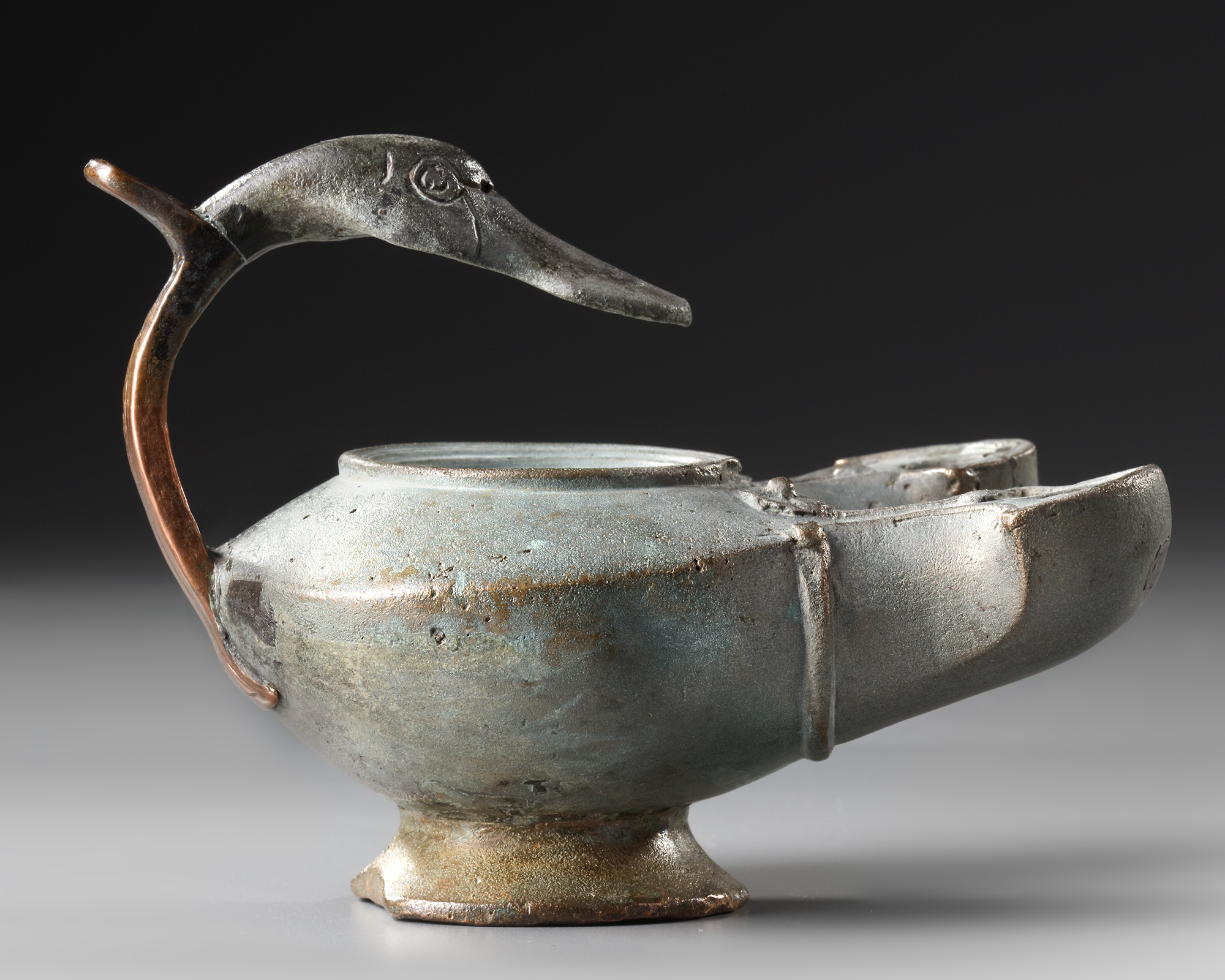 A ROMAN BRONZE OIL LAMP WITH DUCK HEAD, CIRCA 1ST-2ND CENTURY A.D.