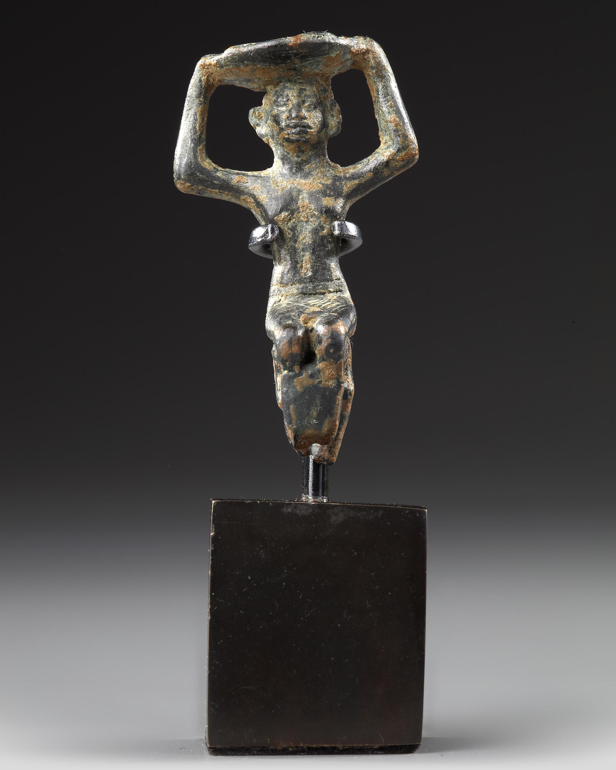 A WESTERN ASIATIC PROTO-ELAMITE STATUETTE, CIRCA 3100-2700 B.C.