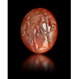 A ROMAN CARNELIAN INTAGLIO OF A GODDESS, CIRCA 2ND-3RD CENTURY A.D.