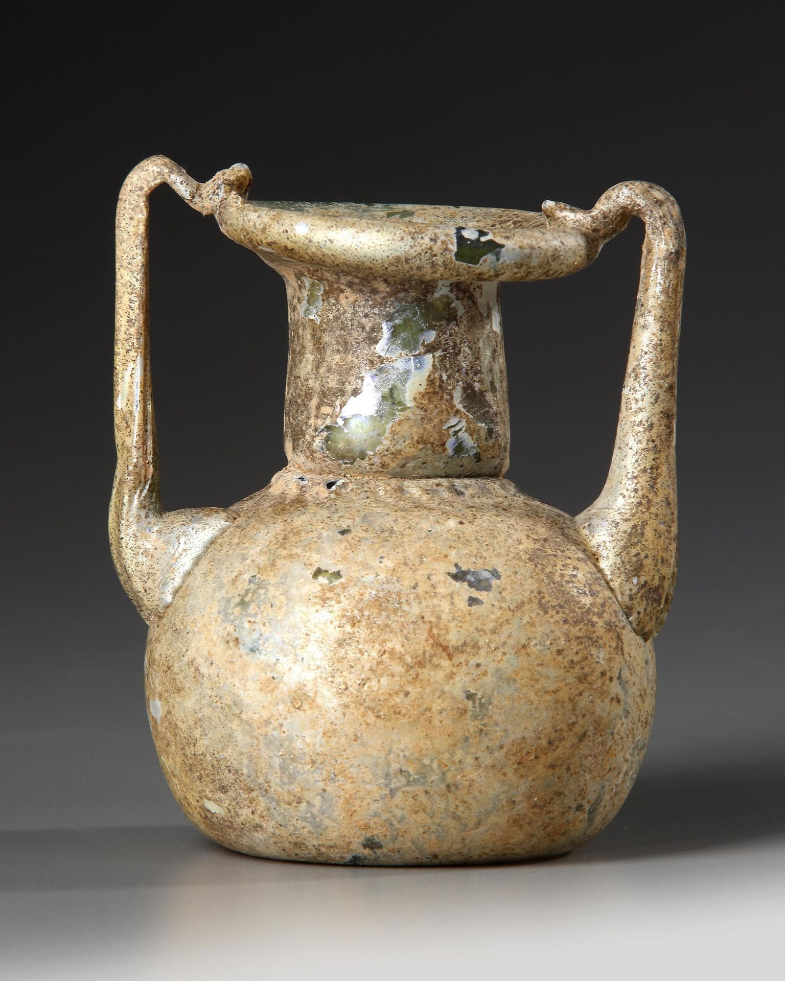 A ROMAN GLASS JAR WITH TWO HANDLES, CIRCA 3RD-4TH CENTURY A.D. - Image 3 of 4