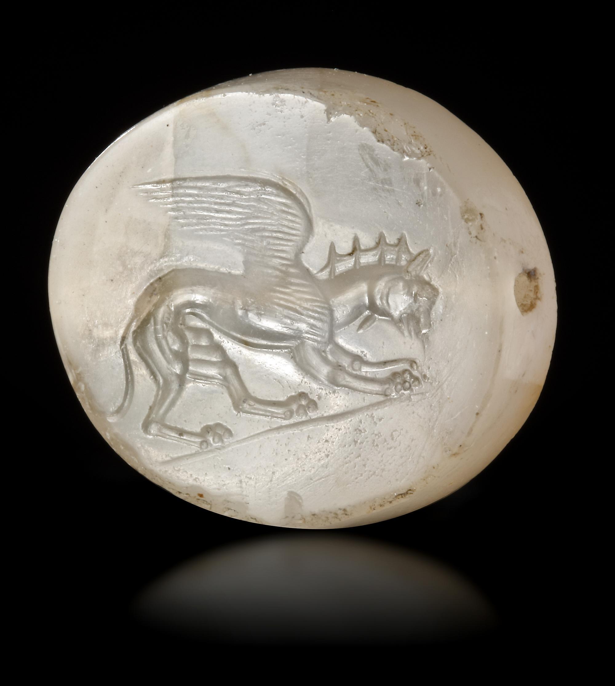 A GRECO PERSIAN CHALCEDONY SCARABOID OF A GRIFFIN, CIRCA 5TH-4TH CENTURY B.C.