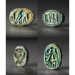 A GROUP OF EGYPTIAN GLAZED COMPOSITION SCARAB SEALS WITH HIEROGLYPHIC MOTIF, MIDDLE TO LATE KINGDOM,