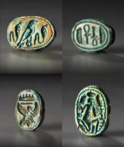 A GROUP OF EGYPTIAN GLAZED COMPOSITION SCARAB SEALS WITH HIEROGLYPHIC MOTIF, MIDDLE TO LATE KINGDOM,