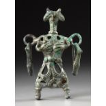 AN AMLASH OPENWORK BRONZE IDOL, CIRCA 1ST CENTURY B.C.