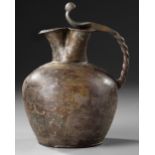 A ROMAN BRONZE TREFOIL OINOCHOE, CIRCA 1ST A.D.